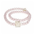 Rose quartz bracelet on clean white background for love and self-love
