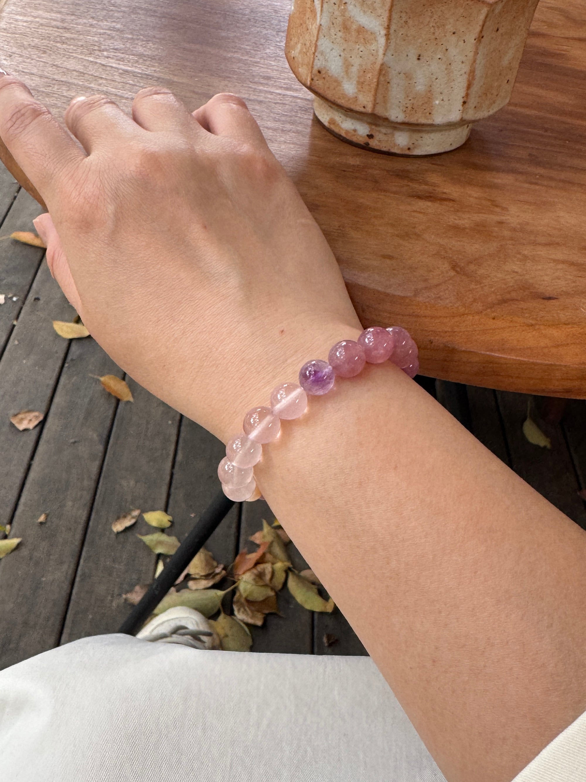 Rose quartz crystal bracelet worn on wrist close-up for love and emotional connection
