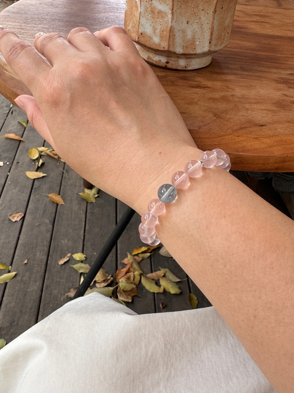 Rose quartz crystal bracelet worn on wrist close-up for love and emotional connection