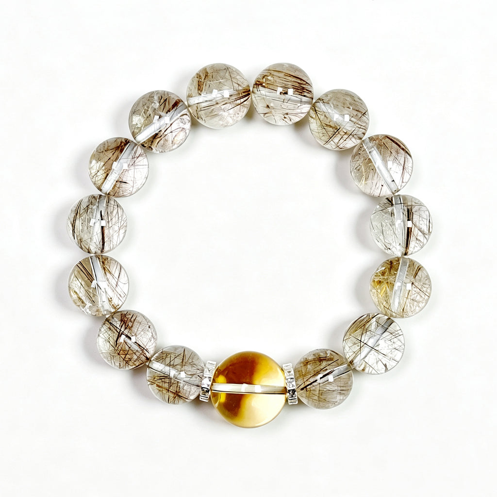 Top view of Silver Rutilated Quartz manifestation crystal bracelet showing full bead arrangement