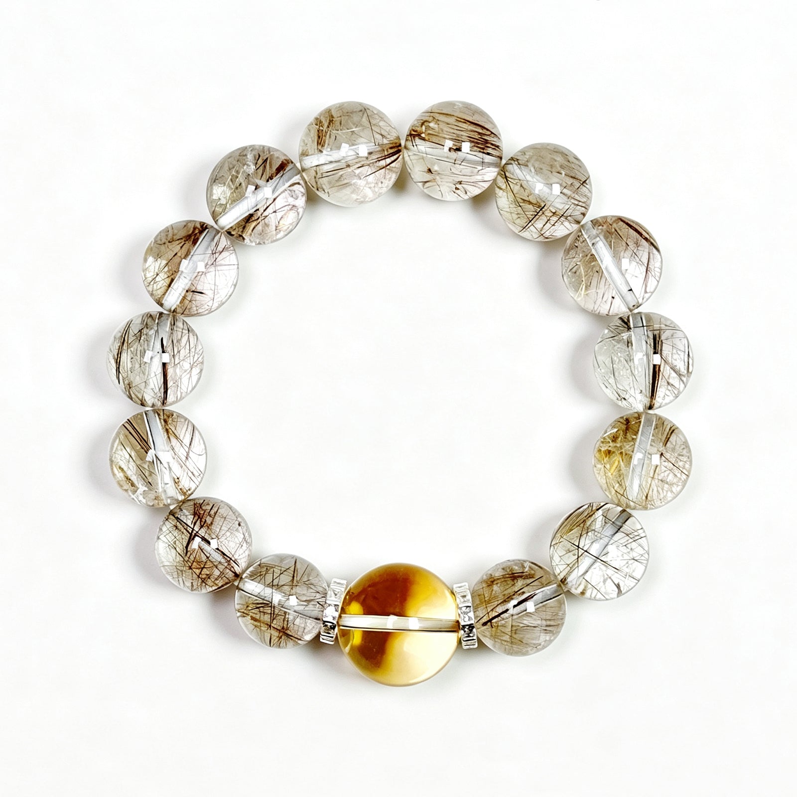 Top view of Silver Rutilated Quartz manifestation crystal bracelet showing full bead arrangement