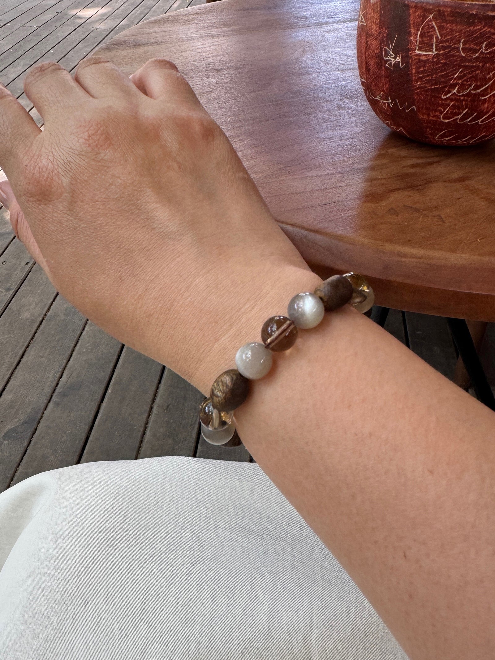 Smoky quartz bracelet showing the alternate side of the detailed bead arrangement on wrist