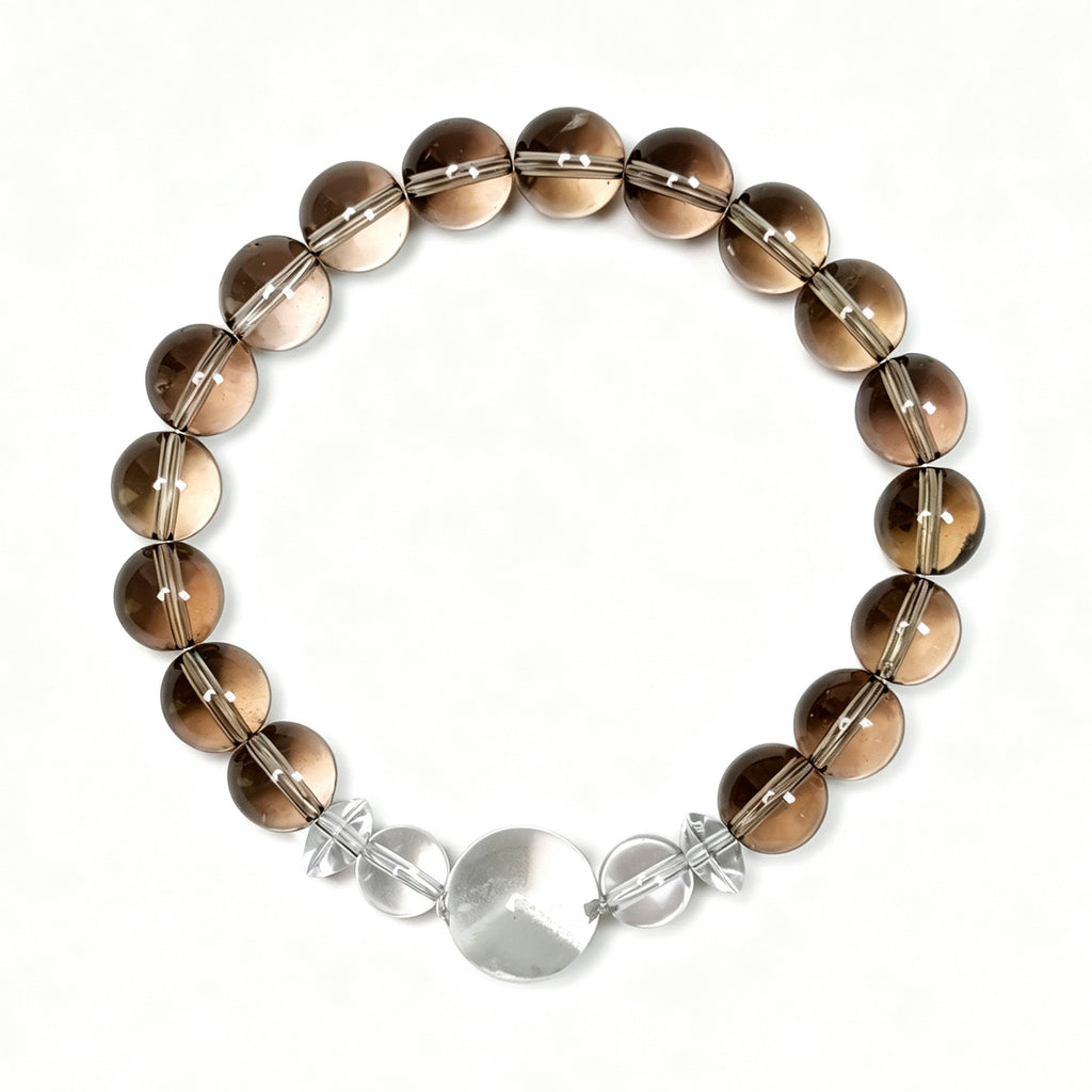 Top view of smoky quartz and white phantom quartz bracelet showing full bead arrangement for grounding and emotional balance