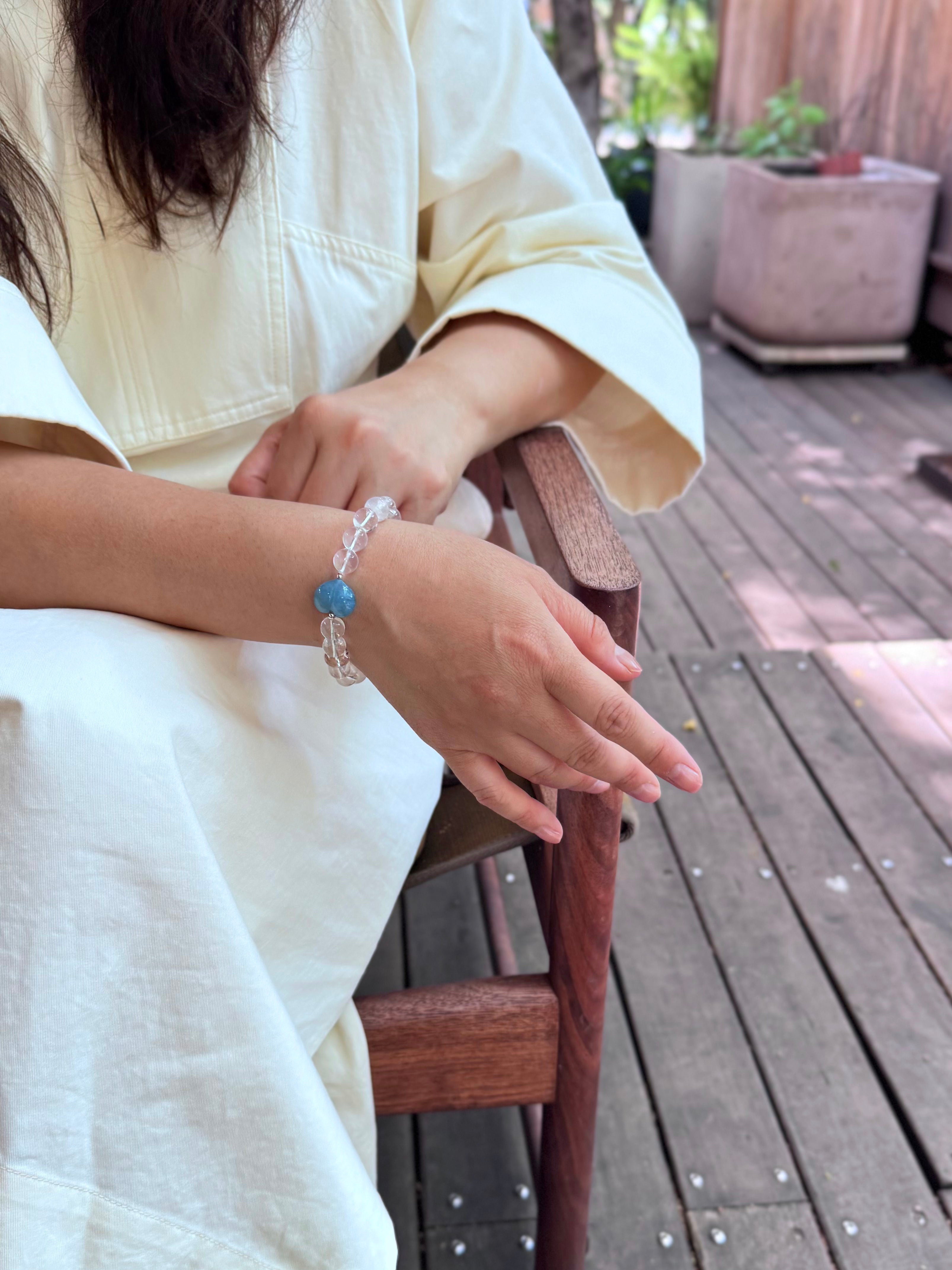 Snow Strawberry Quartz bracelet worn naturally in a calm and relaxed lifestyle setting