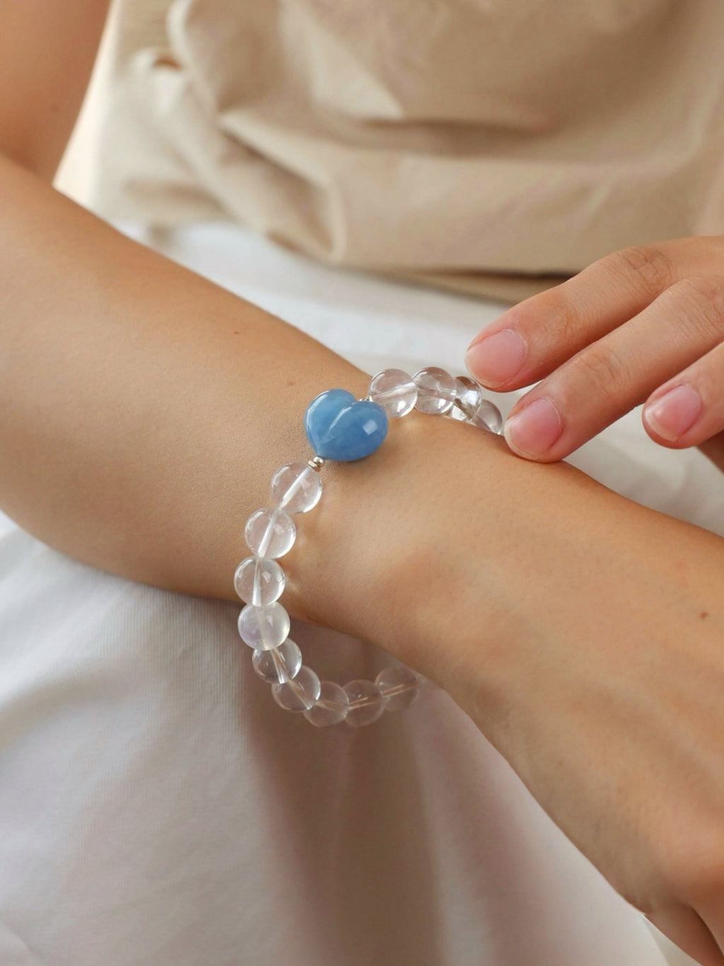 Snow Strawberry Quartz, Moonstone and Aquamarine bracelet worn on wrist