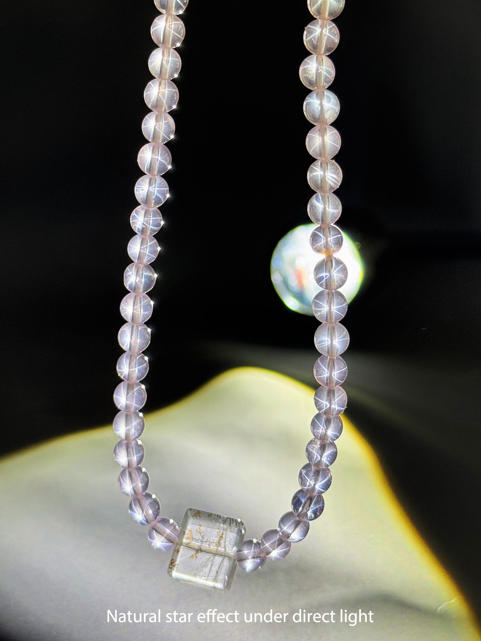 Close-up detail of natural Star Rose Quartz showing soft luminous glow and internal texture