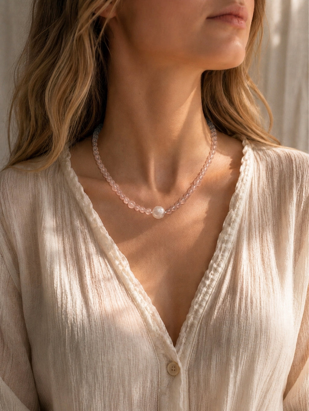 Star rose quartz necklace worn on model