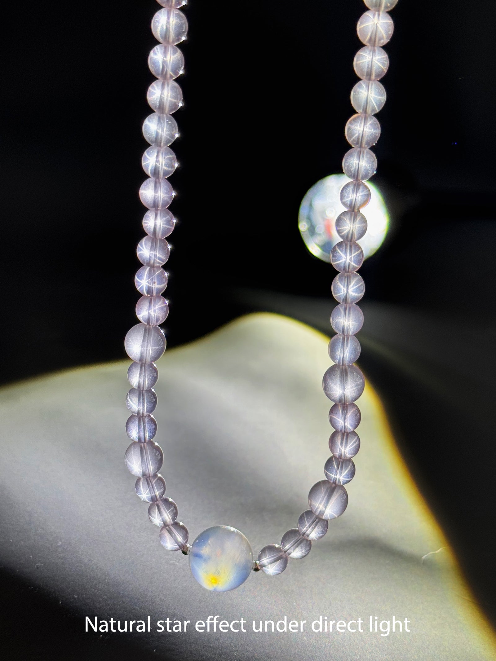 Close-up detail of natural Star Rose Quartz showing soft luminous glow and internal texture