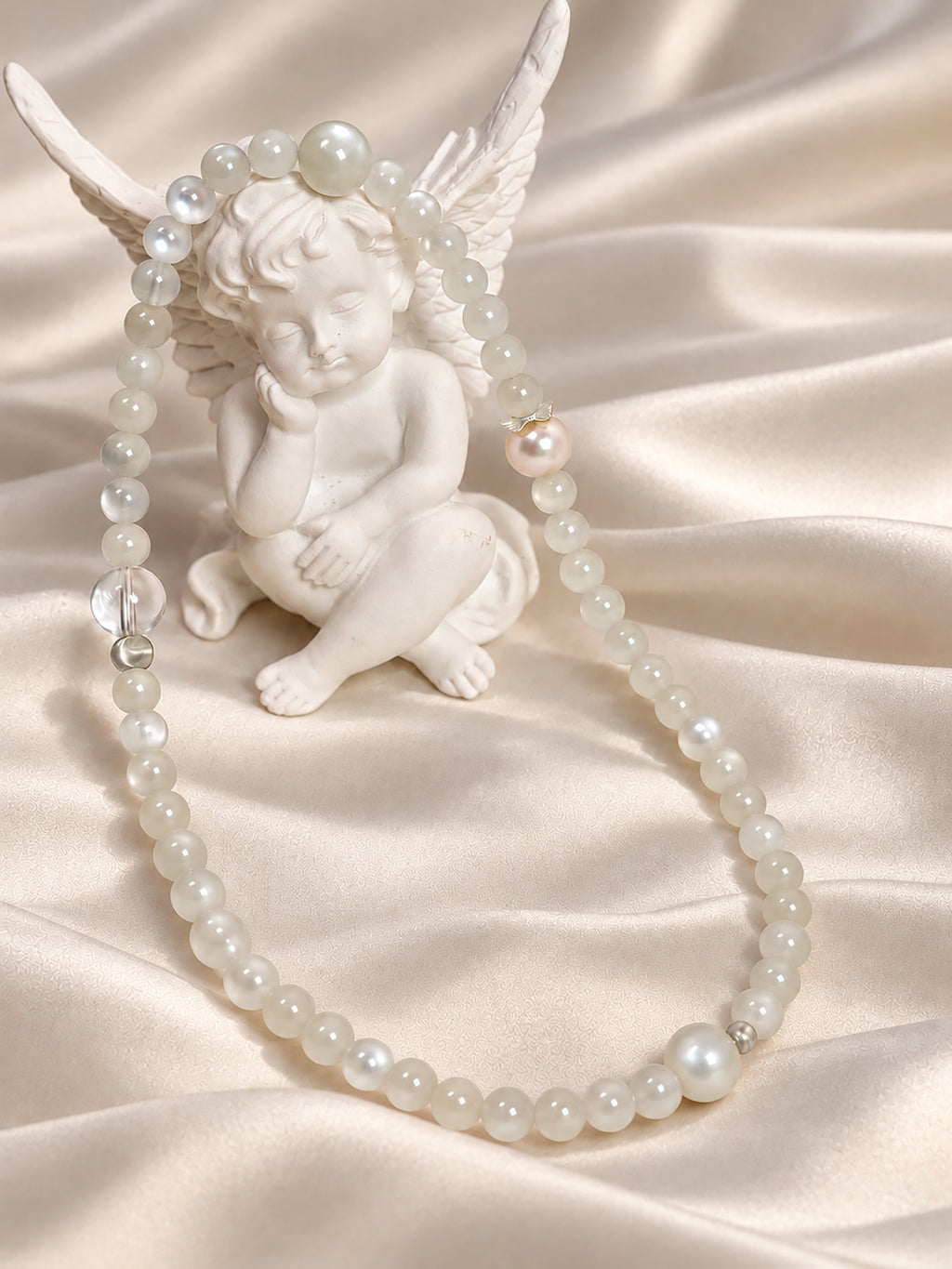 White Moonstone bracelet styled with natural textures in a calming lifestyle setting
