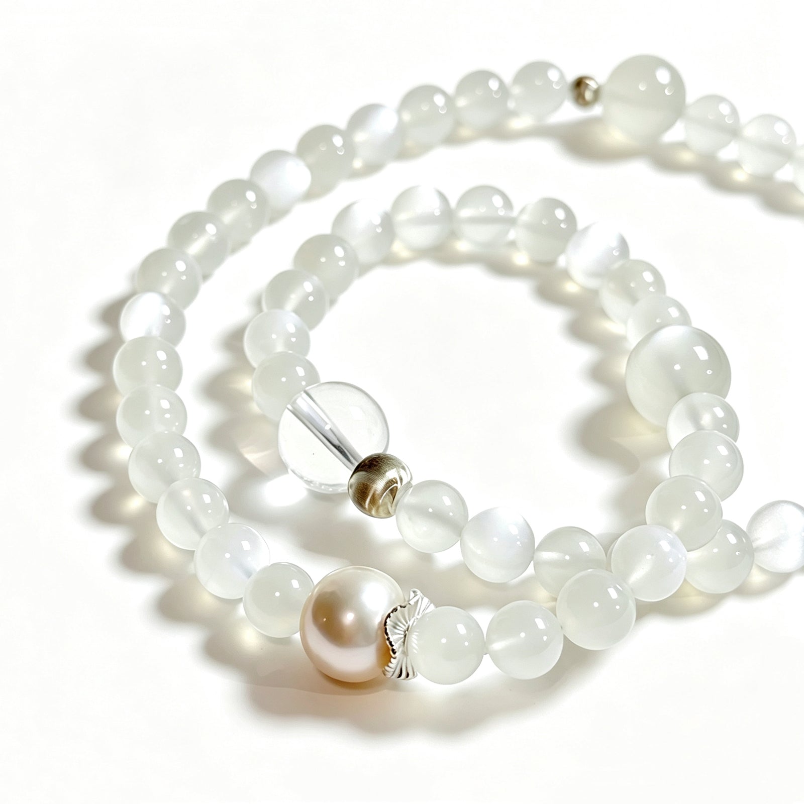 Close-up detail of White Moonstone, Clear Quartz and Freshwater Pearl bracelet showing natural gemstone texture